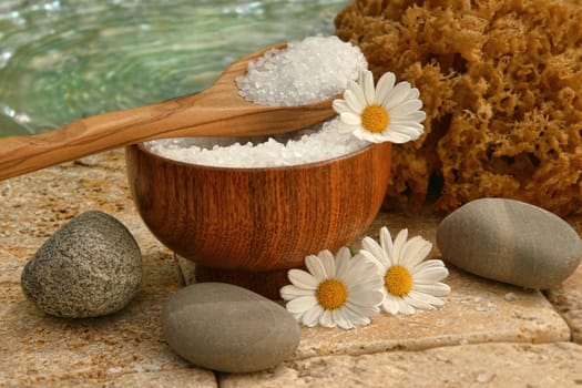Spa still life with bath salts and daisies
