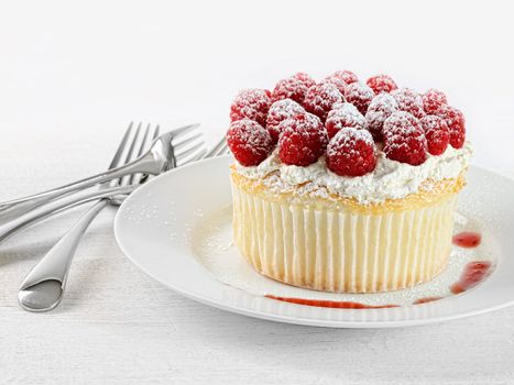 Cupcake with raspberries and cream