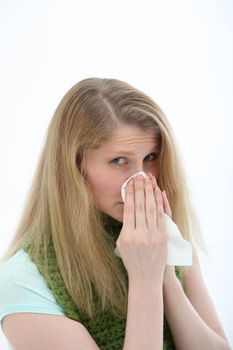 Young woman with a bad cold and sniffly nose