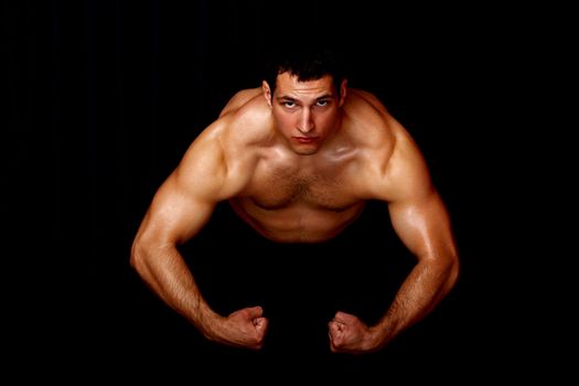 bodybuilder showing his strength