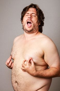 Man pleasuring his own nipples