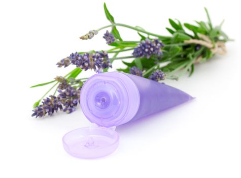 Lavender soothing cream tube and lavender flower, isolated on wh