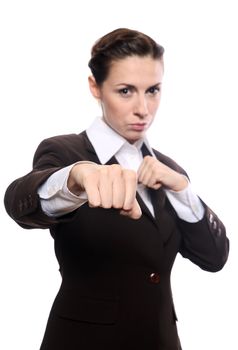Young businesswoman punching