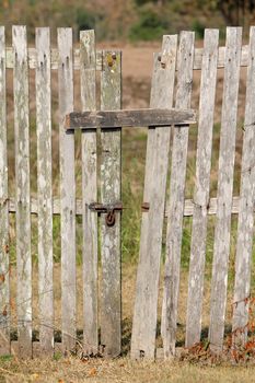 old wooden fence with a gate 