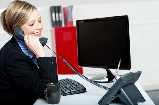 Female secretary answering bosses call