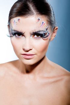 Fashion model with face art makeup