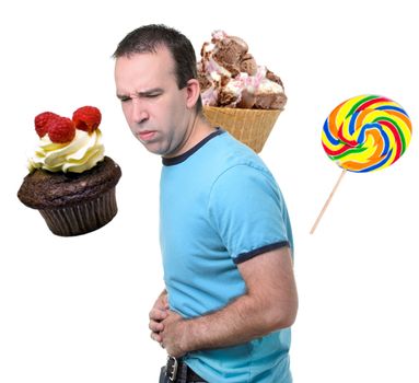 A man is suffering from a stomach ache from eating sweets, isolated against a white background.