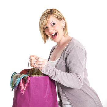 Ecstatic shopaholic with full carrier bag 