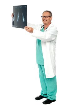 Full length shot of a surgeon with x-ray report