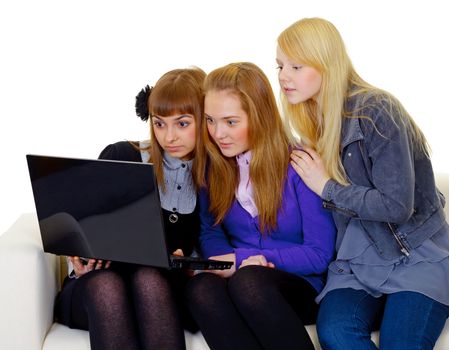 Female teenagers with a laptop