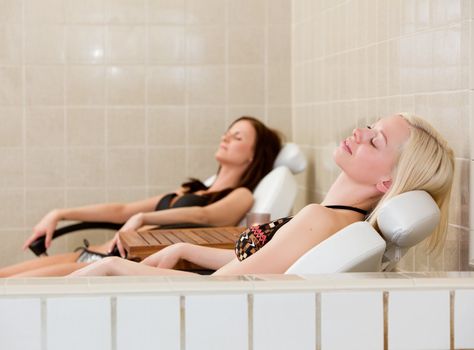 Two Woman relaxing at Spa Pool