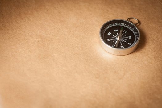 Compass on Light Brown Background