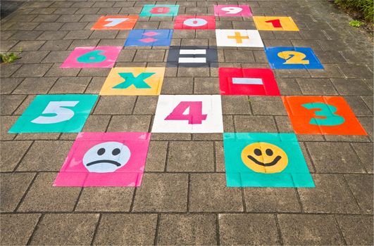 Streetgame for children on sidewalk