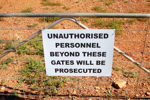 Warning sign on fence in Australia