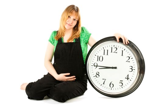 pregnant woman with a clock 
