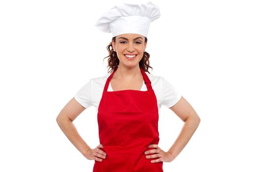 Cure female chef posing with hands on her waist