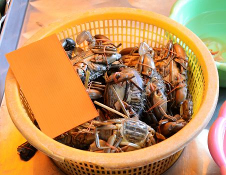 Crabs in basket for sale, seafood markets 