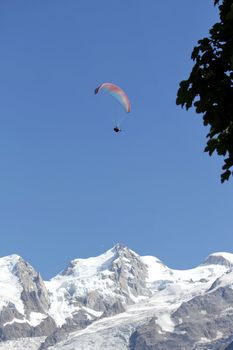 Paraglider upon the Alps mountains