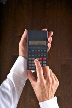 hands with scientific calculator