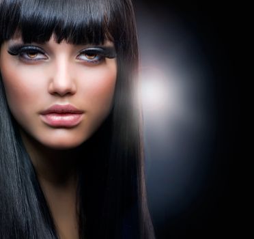 Fashion Brunette.Beautiful Makeup and Healthy Black Hair