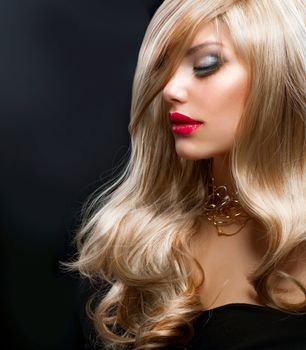 Blond Hair. Beautiful Blond Woman over Black