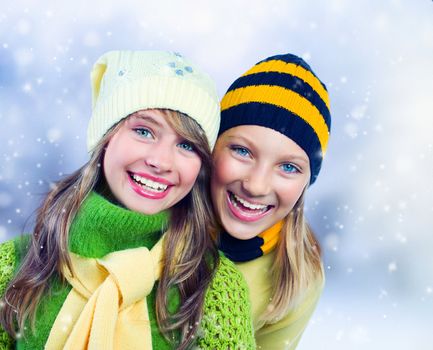 Winter Teenage Girls outdoors.Holidays.Happy Teens.