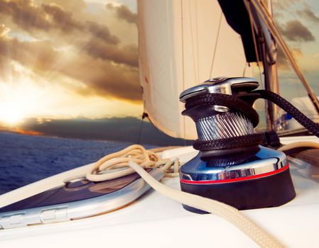 Yacht Sailing against sunset.Sailboat.Travel