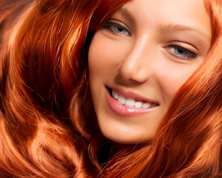 Hair. Beautiful Girl With Healthy Long Red Curly Hair