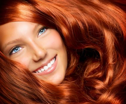 Hair. Beautiful Girl With Healthy Long Red Curly Hair 
