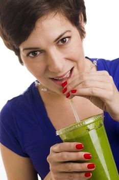 Woman sips Green Smoothie