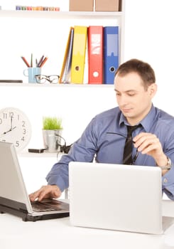 businessman with laptop computer in office