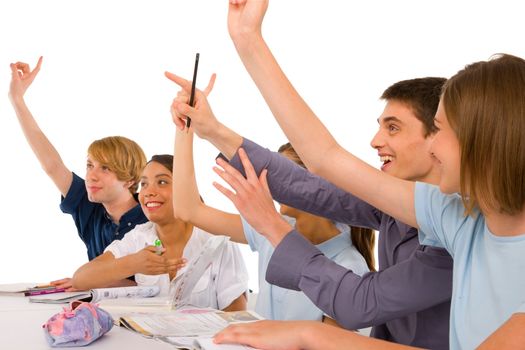 teenagers in classroom with arms up