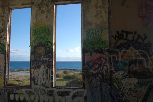 Ocean view from the window of abandoned power station