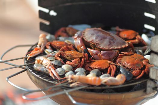 crabs shrimps on charcoal grill