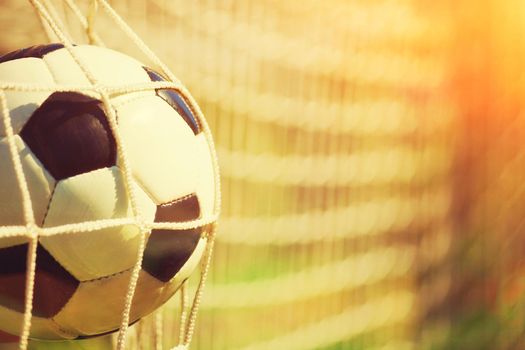 Soccer ball in the net of a goal. Soccer concept
