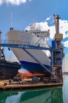 Large ship in dry dock of shipyard