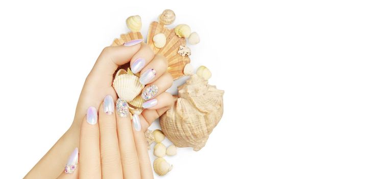 Summer fashion and beauty hand care concept with seashells