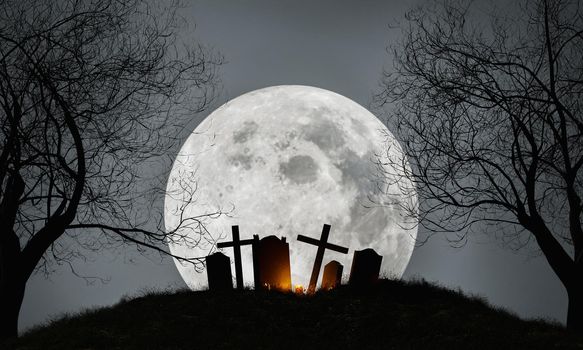 Halloween background of a graveyard with a full moon