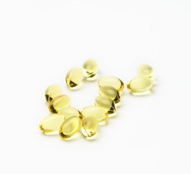fish oil capsules on white background, food supplement for health