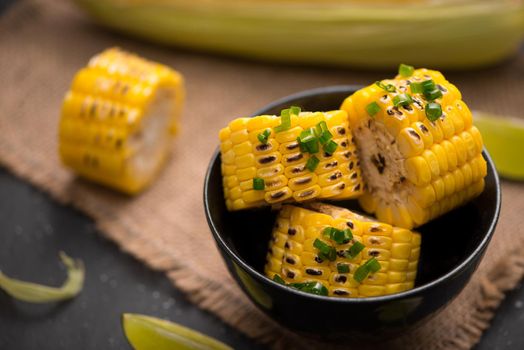 Tasty sweet grilled corn with onion sauce