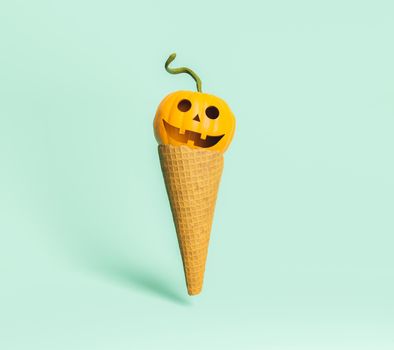 Ice cream wafer with a happy halloween pumpkin