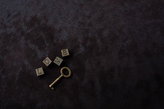 Key and love wording on a dark background