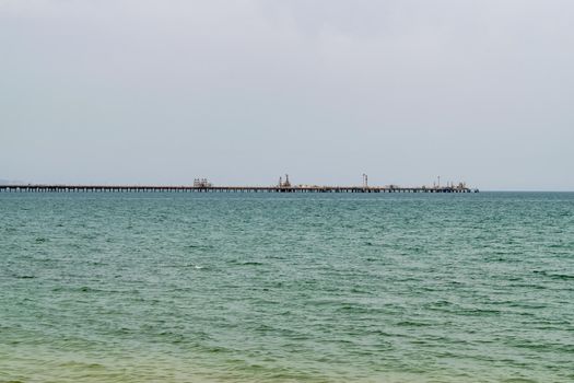 An oil pipeline and a dock for oil tankers.