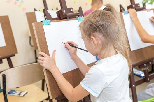 Drawing class in elementary school with easels