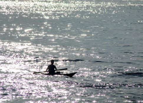 Kayaking man on the sea in summer season.