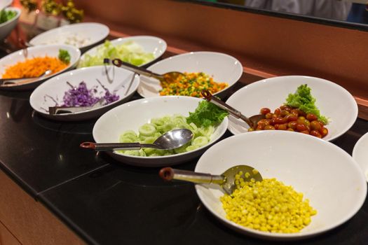 Variety of fresh salads in a buffet