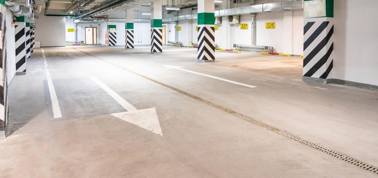 Underground parking garage, empty modern industrial interior
