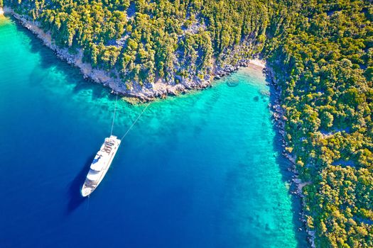 Aerial view of luxury large yacht anchored in turquoise bay of Mali Losinj island