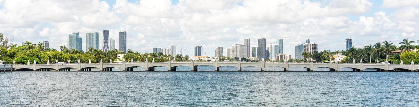 Miami skyline with skyscrapers and bridge over sea