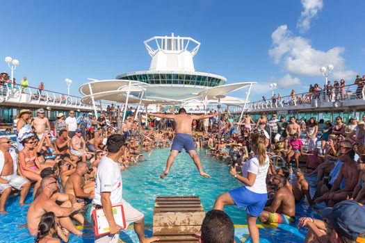 People having fun in pool on cruise ship